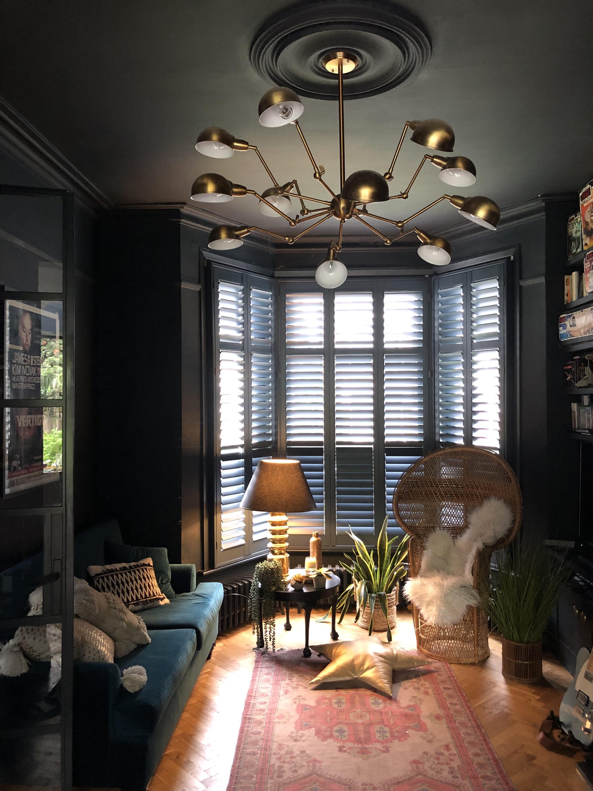 Room with dark shutters