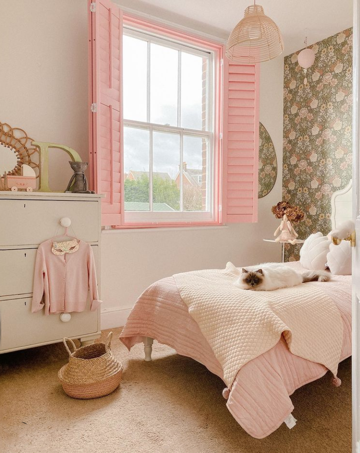 Room with pink shutters